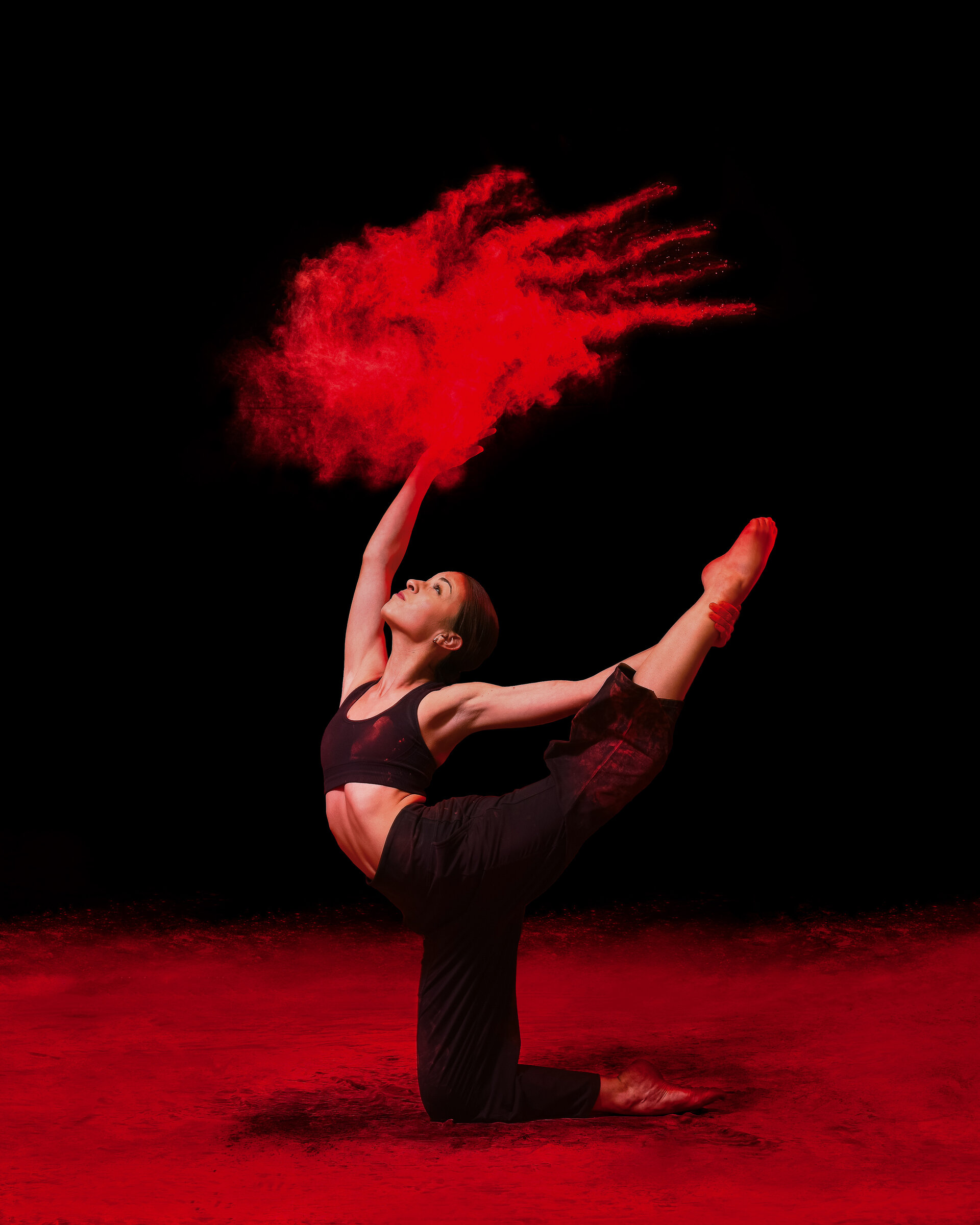 Maya in artistic pose with red powder
